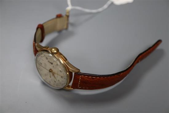 A gentlemans 1950s? 18k Titus manual wind chronograph wrist watch, on later strap, case diameter 37mm, gross 44.2 grams.